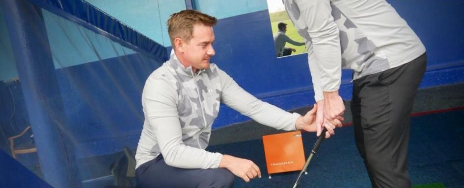 Image of Matthew Cornall helping a golf player at Slinfold Golf Club